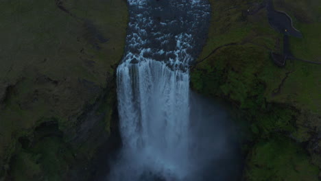 Overhead-view-of-Skogafoss-waterfall-in-southern-Iceland.-Top-down-view-of-the-jump-of-Skoga-river-into-waterfall,-one-of-the-most-famous-in-Iceland.-Beauty-on-earth.-Skogafoss-waterfall