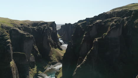 Aerial-drone-view-of-Fjadrargljufur-canyon-in-South-Iceland.--Birds-eye-of-massive-canyon-about-100-meters-deep-and-about-2-kilometers-long.-Amazing-on-earth.-Fjadrargljufur-canyon