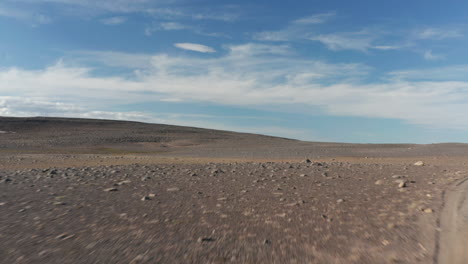 Birds-eye-volcanic-rock-desert-in-Iceland-highlands.-Drone-view-car-stopped-in-icelandic-rocky-countryside.-Iceland-desert-landscape.-Volcanic-rock-desert