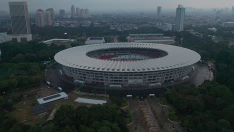 Close-up-tilting-aerial-shot-of-Gelora-Bung-Karno-athletic-stadium-facilities-in-modern-city-center-of-Jakarta