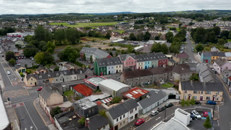Aerial-view-of-houses-in-town.-Slide-and-pan-shot-of-bright-colour-buildings-in-Carmody-Street-Business-Park.-Ennis,-Ireland