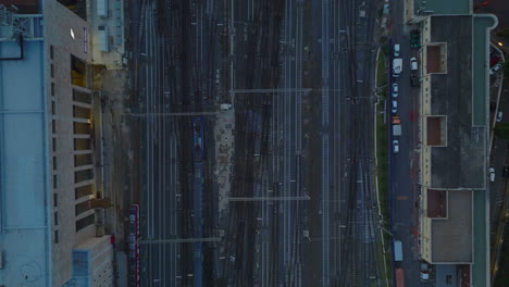 Top-down-panning-footage-of-train-passing-through-turnouts-on-railway-track.-Approaching-central-train-station.-Rome,-Italy