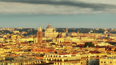 Towers-of-Basilica-of-Saint-Mary-Major-protruding-above-town-development-in-morning-sun.-St.-Peters-Basilica-in-Vatican-City-in-background.-Rome,-Italy