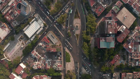 Aerial-birds-eye-overhead-top-down-view-of-heavy-traffic-in-city-streets.-Multilane-crossroads-from-drone-flying-forward.-Mexico-city,-Mexico.