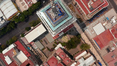 Aerial-birds-eye-overhead-top-down-panning-view-of-buildings-in-downtown.-Drone-flying-over-Torre-Latinoamericana-and-Palacio-de-Bellas-Artes.-Mexico-city,-Mexico.