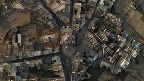 Church-in-Center-of-Gozo,-Malta-Island-Small-Township-in-Brown-and-Beige-Sand-Color,-Aerial-Birds-Eye-Overhead-Top-Down-View