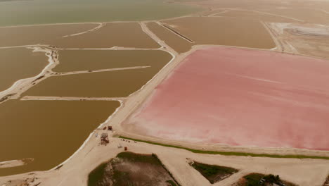 Forwards-fly-above-system-of-ponds-for-salt-extraction.-Peculiar-colours-due-to-micro-organisms-in-colourful-lakes.-Las-Coloradas,-Yucatan,-Mexico