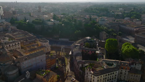 Fly-above-historic-landmarks-in-city-centre.-Aerial-view-of-old-buildings-and-tourist-sights.-Rome,-Italy