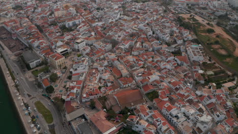 Amazing-aerial-drone-view-flying-above-Lagos-city-in-Algarve,-Portugal,-circle-pan,-day