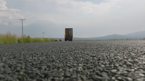 Low-angle-view-of-vehicles-driving-on-road.-Detailed-shot-of-rough-structure-of-asphalt-road-surface.-South-Africa