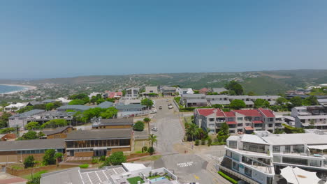 Modern-apartment-buildings-in-luxury-urban-borough-near-seaside.-aerial-view-of-town-development.-Plettenberg-Bay,-South-Africa