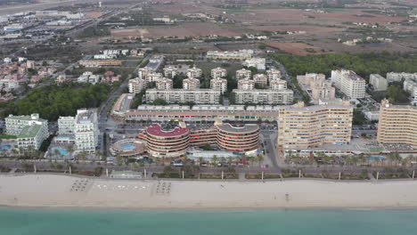 AERIAL:-Hotels-on-Palma-Beach-first-Row-with-Ocean-and-Beach-on-Tropical-Island-Mallorca,-Spain-on-Sunny-Day-Vacation,-Travel,-Sunny