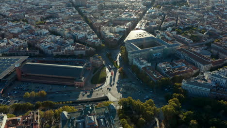 Amazing-aerial-view-of-heavy-traffic-on-roads-and-various-buildings-around-Atocha-train-station-in-late-afternoon-sunshine.
