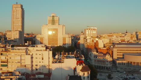 Forwards-fly-above-buildings-around-Spain-square.-Famous-historic-high-rise-constructions-at-golden-hour.