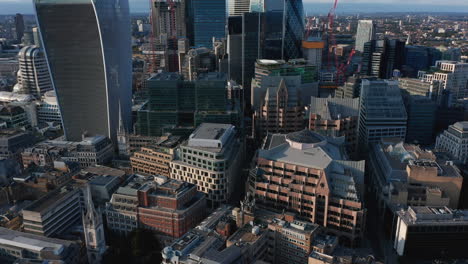Aerial-view-of-modern-City-business-and-finance-district.-Tilt-down-view-to-Minster-Court-building.-London,-UK
