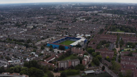 Aerial-panoramic-view-of-urban-neighbourhood.-Queens-Park-Rangers-football-stadium-between-family-and-terraced-houses.-London,-UK