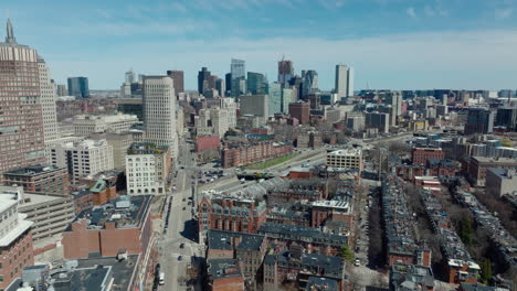 Aerial-panoramic-shot-of-town-development-and-high-rise-office-or-apartment-buildings-in-background.-Boston,-USA