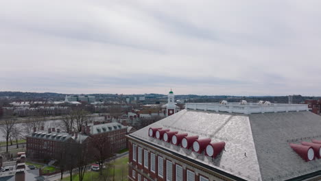 Forwards-fly-over-Malkin-Athletic-Centre-in-Harvard-University-complex.-Revealing-red-bricks-buildings.-Boston,-USA