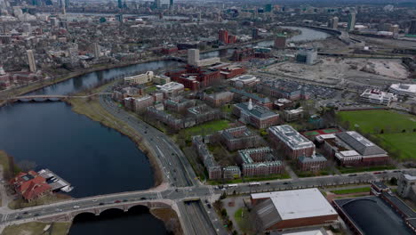 High-angle-view-of-Harvard-Business-School-at-Charles-river-waterfront.-Tilt-up-revealing-cityscape.-Boston,-USA