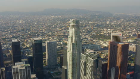 AERIAL:-Wide-shot-of-US-Bank-Skyscraper-Top,Helipad-in-Downtown-Los-Angeles,-California-with-beautiful-sunlight,blue-sky,
