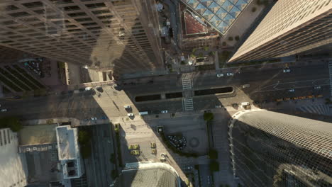 Few-Cars-driving-through-the-City-during-Coronavirus-Covid-19-Pandemic-Lockdown-Aerial-Birds-Eye-View-Overhead-Top-View