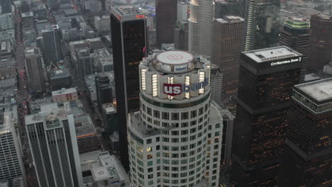 AERIAL:-Beautiful-Overhead-Birds-View-of-US-Bank-Skyscraper-in-Downtown-Los-Angeles,-California-in-Sunset-light