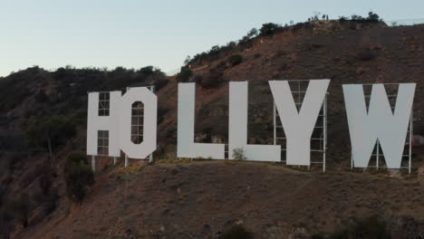 AERIAL:-Very-close-to-Hollywood-Sign-at-Sunset,-Los-Angeles,-California