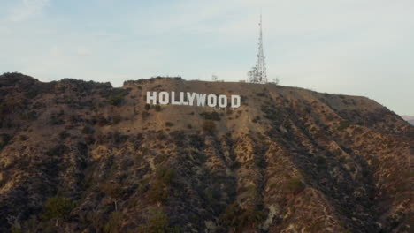 AERIAL:-Wide-Shot-of-Hollywood-Sign-Letters-at-Sunset,-Los-Angeles,-California
