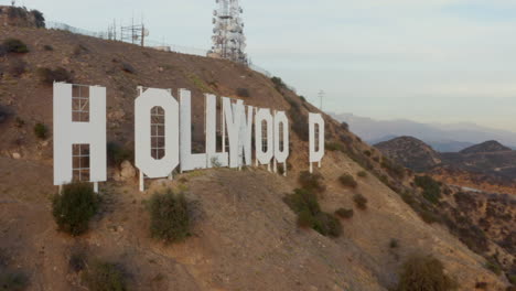 AERIAL:-Close-Up-of-Hollywood-Sign-Letters-at-Sunset,-Los-Angeles,-California