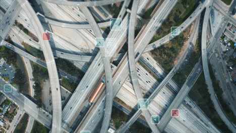 Top-down-footage-of-traffic-on-complex-multilevel-multilane-highway-interchange.-Visual-effects-of-tracking-selected-vehicles-and-providing-information