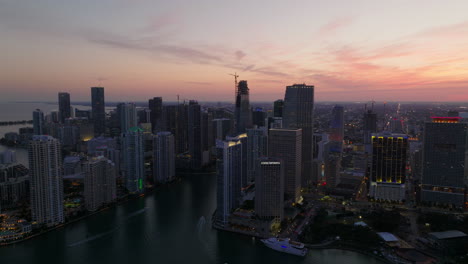 Aerial-panoramic-footage-of-modern-high-rise-downtown-buildings-against-colourful-twilight-sky.-Miami,-USA