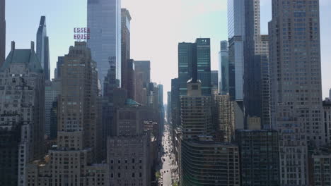 Ascending-footage-of-majestic-tall-downtown-skyscrapers-in-city.-Modern-high-rise-buildings-with-glass-glossy-facades.-Manhattan,-New-York-City,-USA