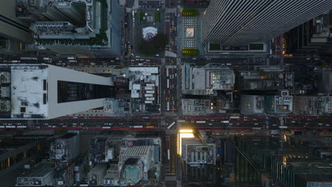 Aerial-birds-eye-overhead-top-down-panning-view-of-traffic-jam-on-avenue-and-surrounding-streets-in-downtown.-Manhattan,-New-York-City,-USA