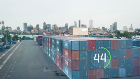 Augmented-reality-in-logistics-showing-figures-about-stacked-naval-containers-in-cargo-terminal.-High-rise-buildings-in-background.-New-York-City,-USA